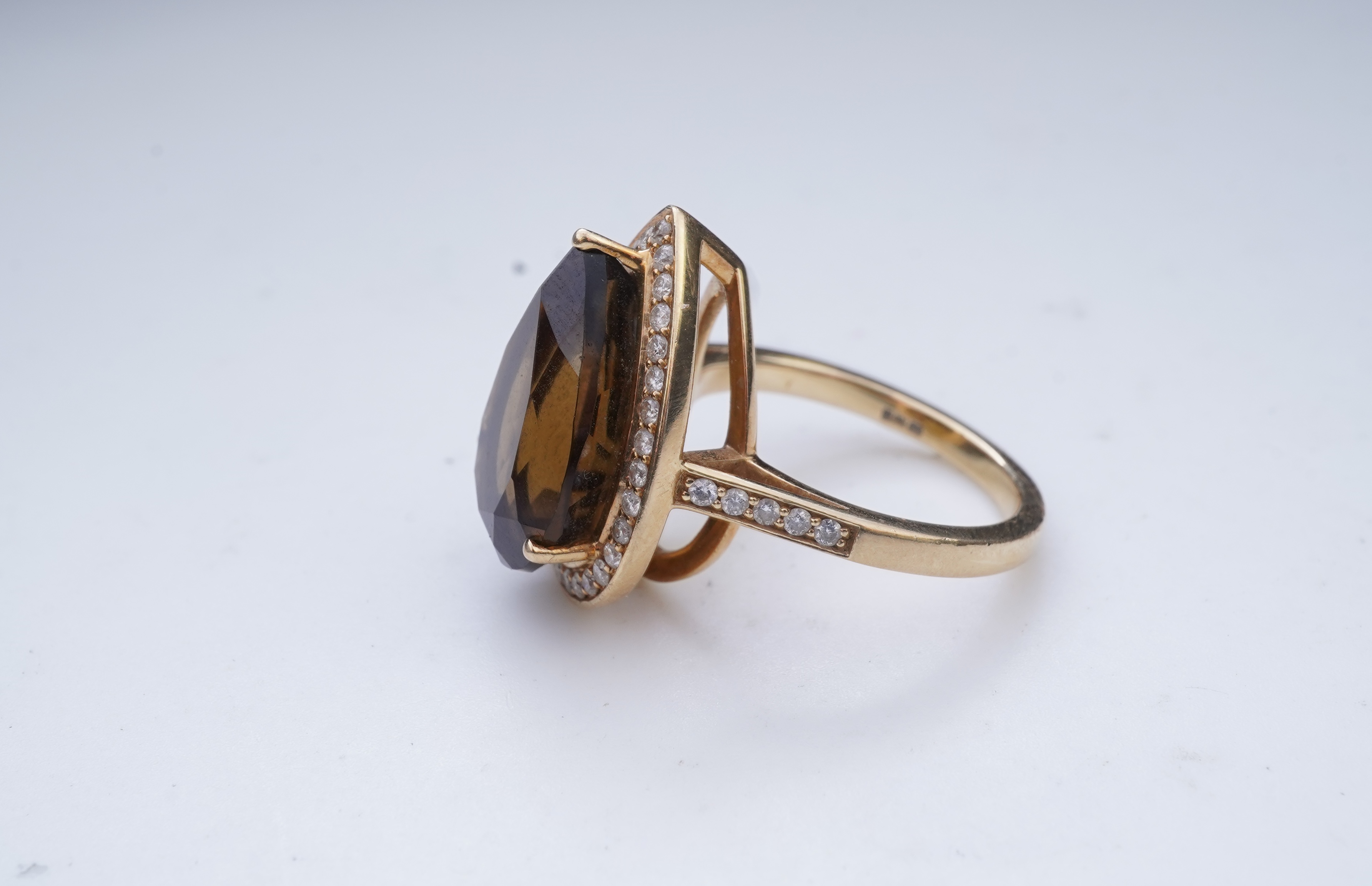 A smoky quartz and diamond ring